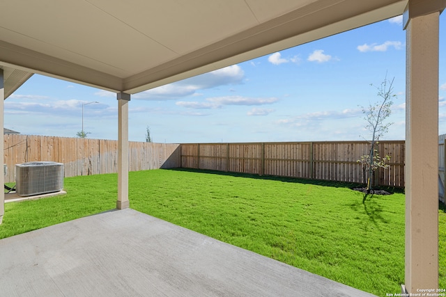 view of yard featuring central AC and a patio area