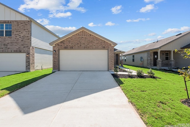 view of front of house with a front lawn and a garage