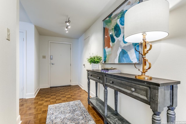 entrance foyer featuring dark parquet floors