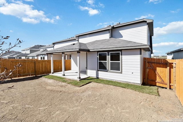 rear view of property featuring a patio