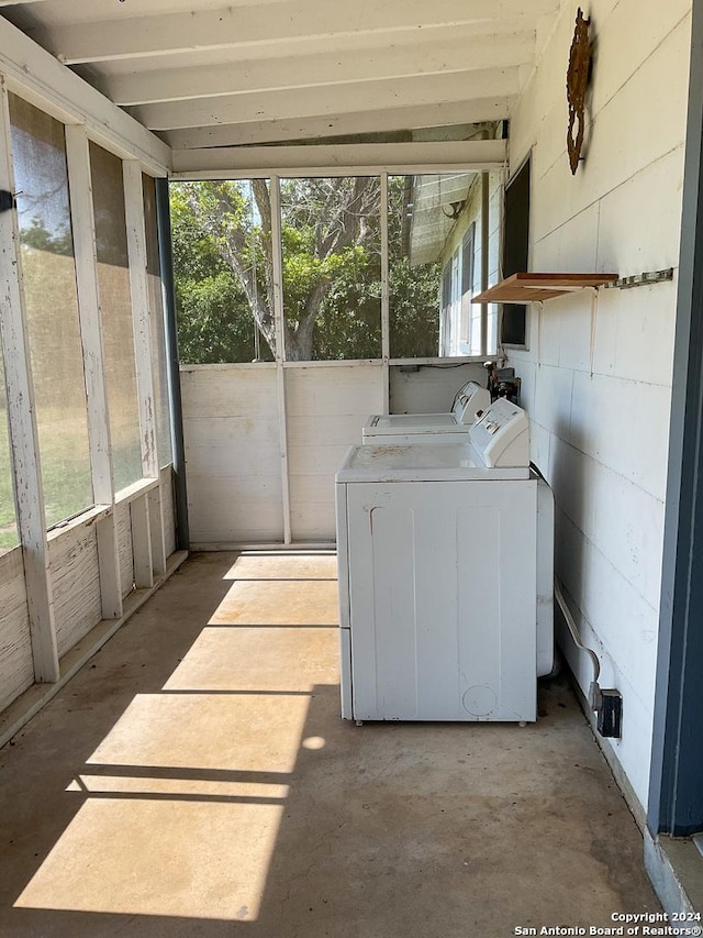 exterior space with a wealth of natural light and washing machine and clothes dryer