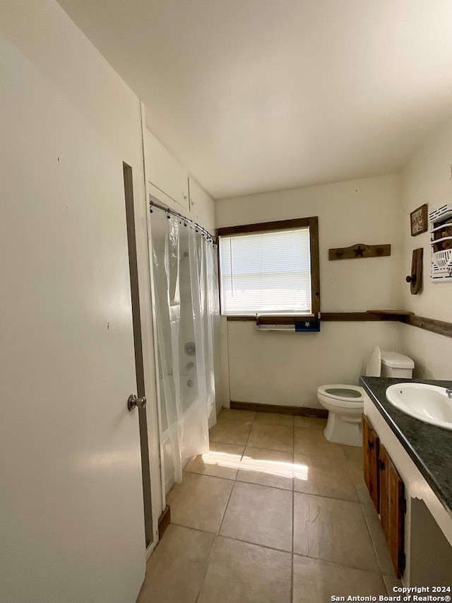 full bathroom with tile patterned flooring, vanity, shower / bath combination with curtain, and toilet