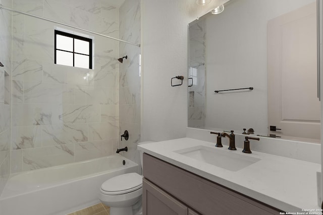 full bathroom with vanity, toilet, and tiled shower / bath