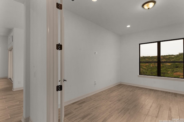 spare room with light wood-type flooring