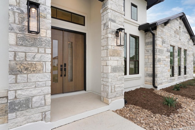 property entrance featuring french doors