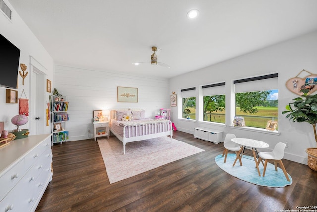 bedroom featuring recessed lighting, dark wood-type flooring, visible vents, baseboards, and radiator