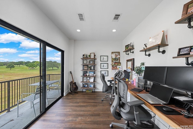 unfurnished office featuring wood finished floors, visible vents, and recessed lighting