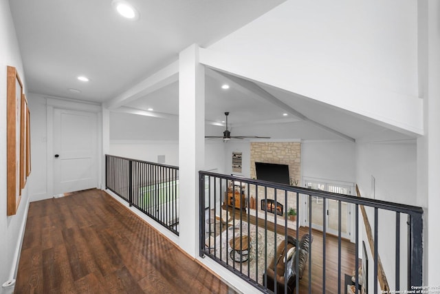 corridor featuring recessed lighting, an upstairs landing, and wood finished floors