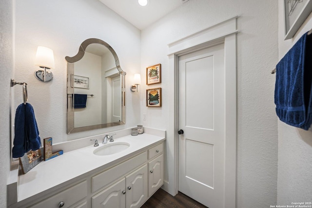 bathroom featuring wood finished floors and vanity