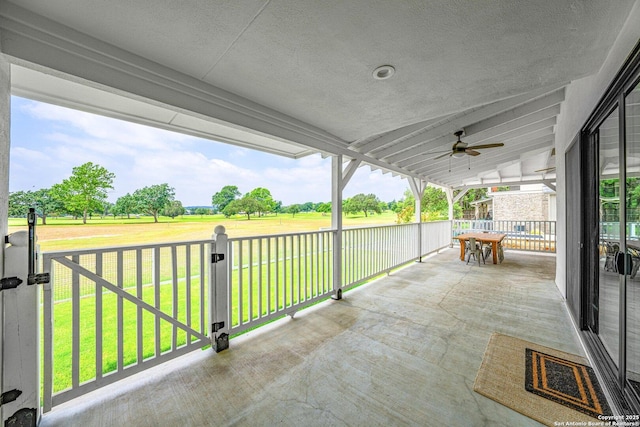 view of patio featuring outdoor dining area and ceiling fan