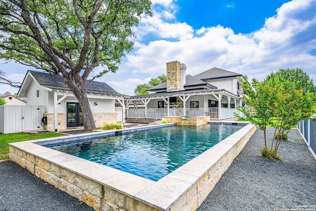 view of swimming pool featuring a fenced in pool, a patio area, and a fenced backyard