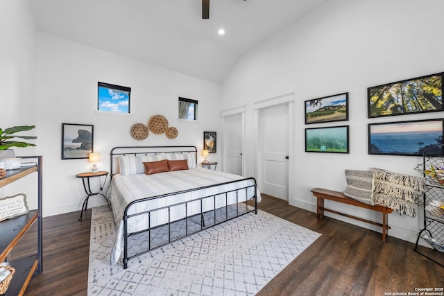 bedroom featuring high vaulted ceiling, recessed lighting, baseboards, and wood finished floors