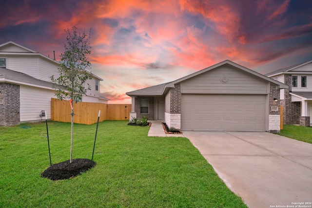 view of front of house with a lawn and a garage