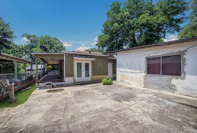 back of house with a patio area and french doors