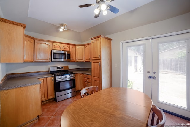 kitchen with light brown cabinets, french doors, ceiling fan, appliances with stainless steel finishes, and light tile patterned flooring