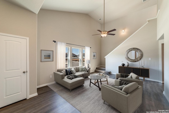 living room featuring ceiling fan, dark wood-type flooring, and high vaulted ceiling