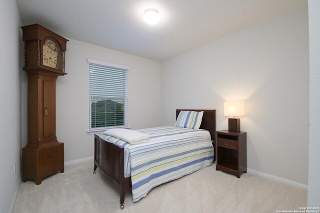 bedroom with light carpet