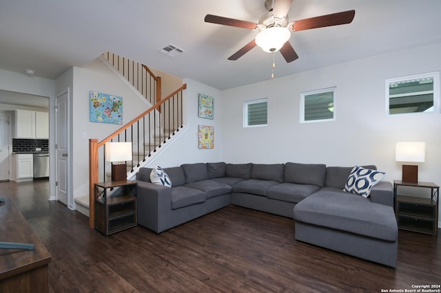 living room featuring dark hardwood / wood-style floors and ceiling fan