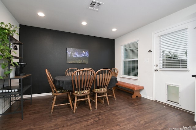 dining area featuring dark hardwood / wood-style floors