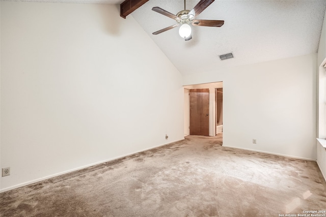 unfurnished bedroom featuring light carpet, lofted ceiling with beams, and ceiling fan