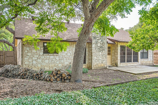 back of property featuring a patio area