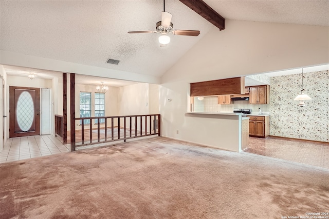 unfurnished living room with light carpet, a textured ceiling, ceiling fan with notable chandelier, high vaulted ceiling, and beamed ceiling