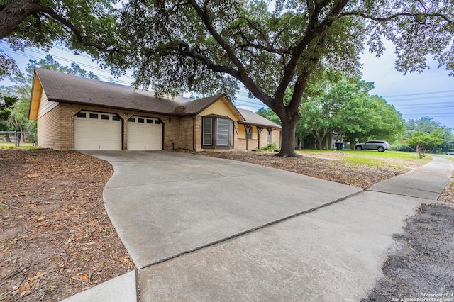 ranch-style house featuring a garage