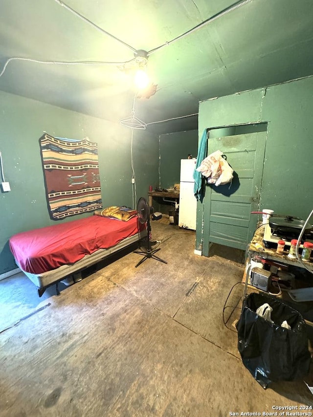 bedroom with white refrigerator