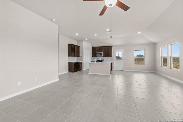 unfurnished living room with light tile patterned flooring, recessed lighting, baseboards, and vaulted ceiling