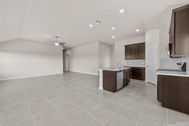 kitchen with a ceiling fan, visible vents, a kitchen island with sink, vaulted ceiling, and open floor plan
