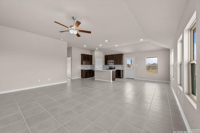 unfurnished living room with baseboards, ceiling fan, lofted ceiling, recessed lighting, and light tile patterned flooring