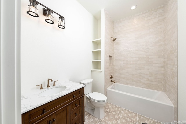 full bathroom with toilet, tiled shower / bath combo, and vanity