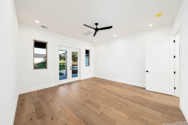 unfurnished room with light wood-type flooring and ceiling fan