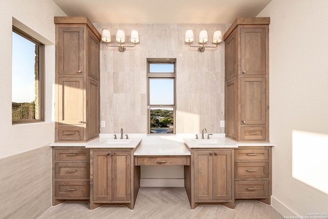 bathroom with vanity, tile walls, and a wealth of natural light