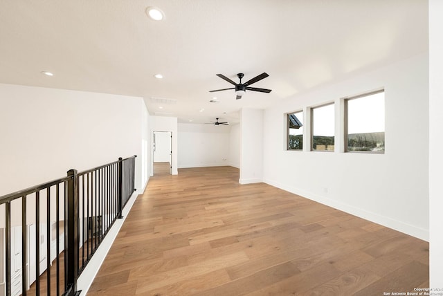 interior space with light hardwood / wood-style floors and ceiling fan