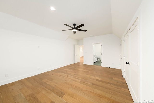 unfurnished bedroom with vaulted ceiling, light wood-type flooring, and ceiling fan