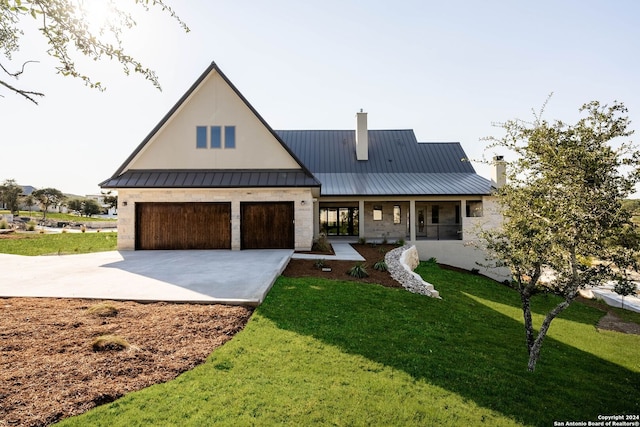 modern farmhouse featuring a front lawn and a porch