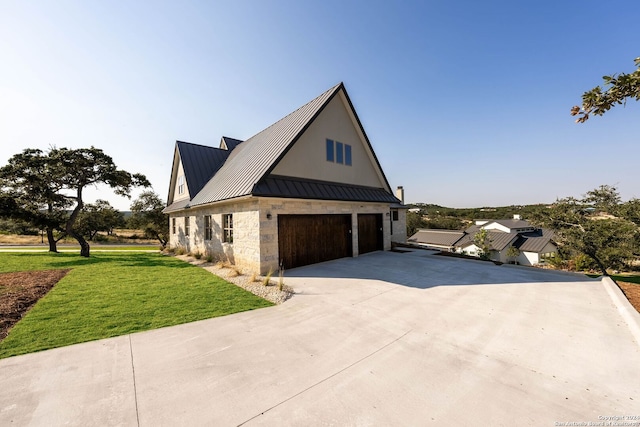 exterior space featuring a yard and a garage