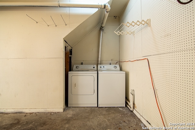 clothes washing area with washer and dryer