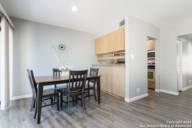 dining room featuring dark hardwood / wood-style flooring