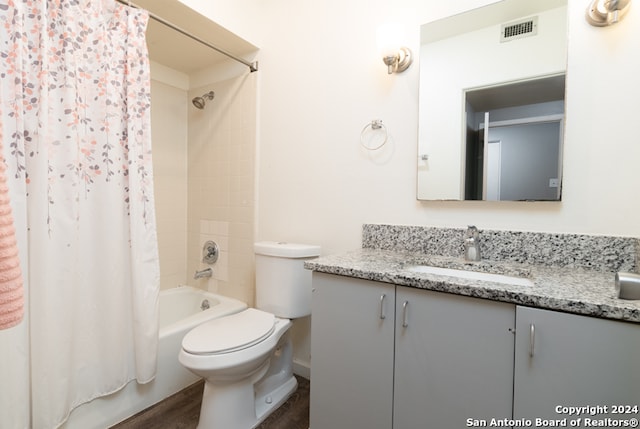 full bathroom featuring toilet, vanity, shower / bath combination with curtain, and hardwood / wood-style flooring