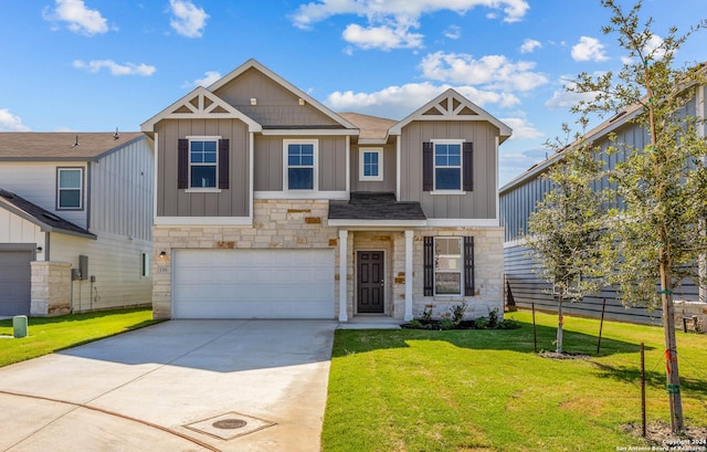 craftsman house with a front yard and a garage