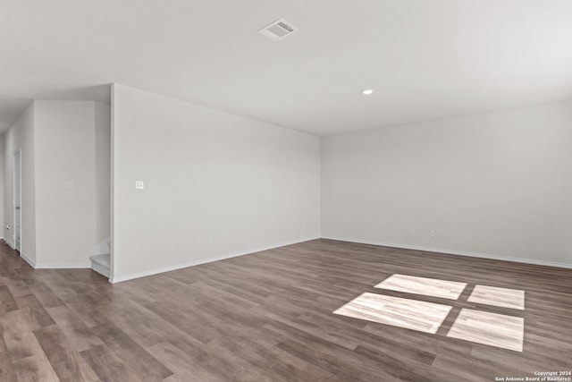 spare room with hardwood / wood-style floors