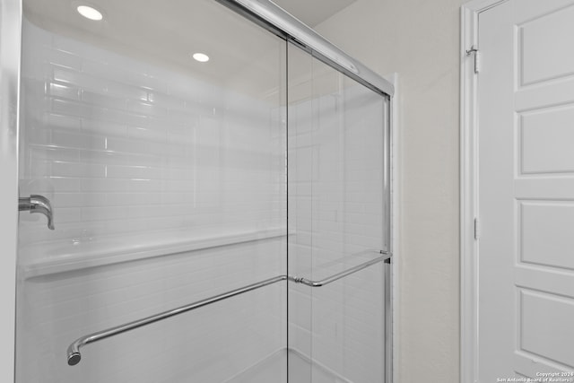 bathroom featuring an enclosed shower