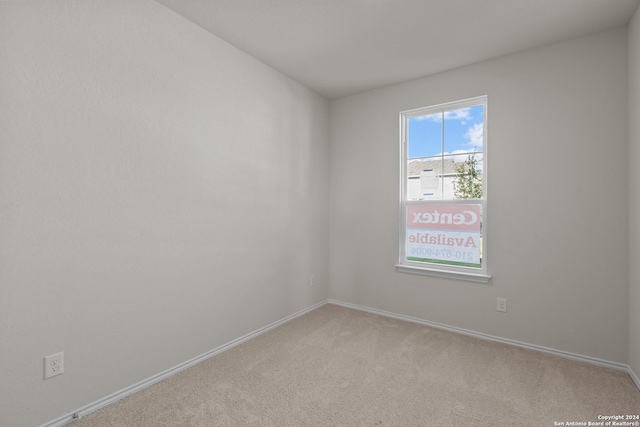 empty room featuring light colored carpet