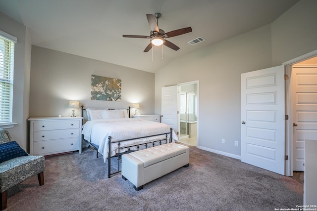 carpeted bedroom with ceiling fan, ensuite bathroom, and vaulted ceiling