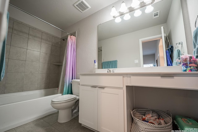 full bathroom featuring toilet, shower / bath combo, vanity, and tile patterned floors