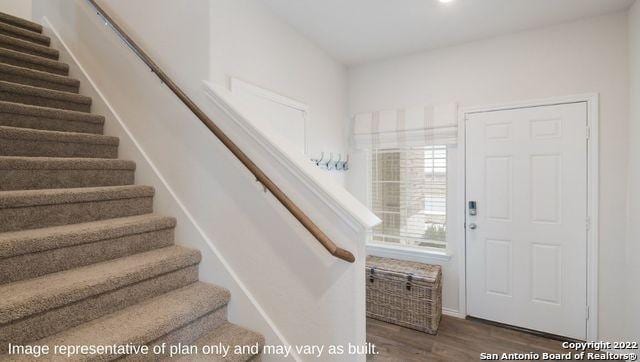 foyer entrance with dark hardwood / wood-style flooring