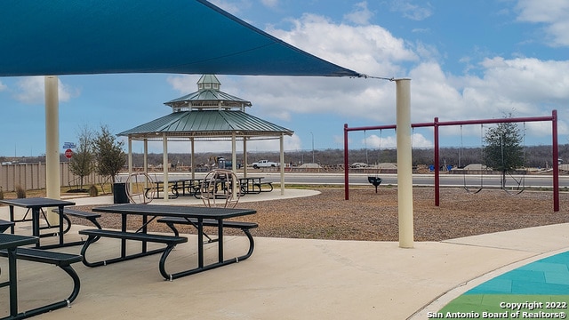 view of home's community with playground community and a gazebo