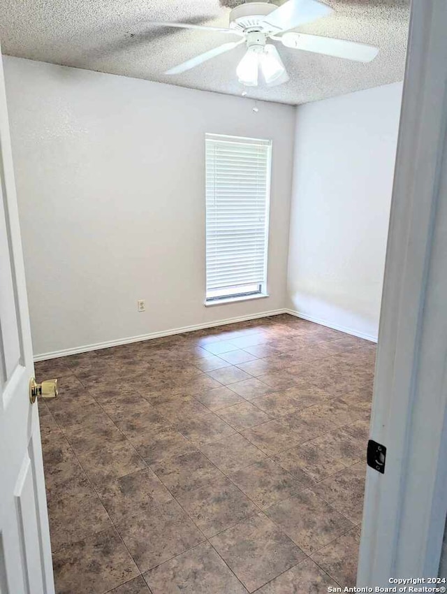 spare room featuring a textured ceiling